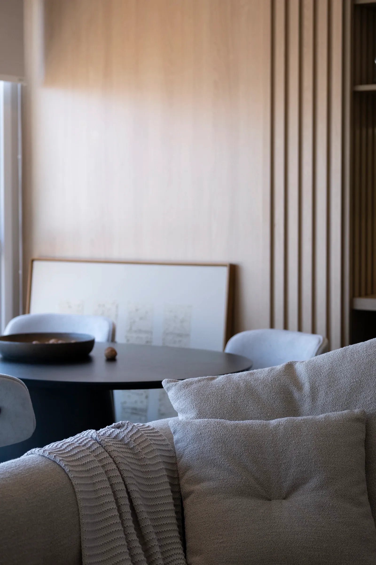 A modern living room with minimalist decor and a neutral palette